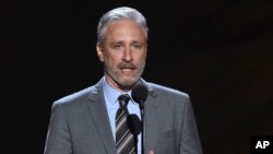 FILE- Jon Stewart presents the Pat Tillman award for service on July 18, 2018, at the ESPY Awards in Los Angeles. Stewart has been named the 23rd recipient of the Kennedy Center's Mark Twain Award for lifetime achievement in comedy. (Photo by Phil McCarten/Invision/AP, File)