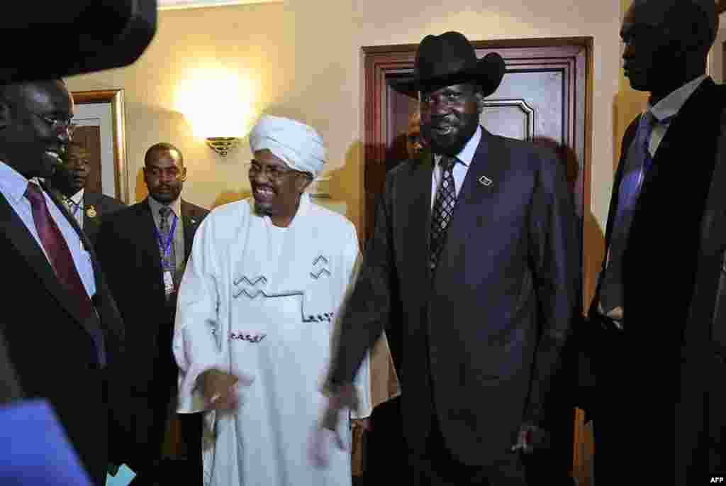 I advise the African Union to ensure South Sudan and Sudan implement the cooperation agreements. The AU should deal with whomever obstructs the implementation of the agreements, regardless of whether they are from Sudan or South Sudan. - Angelo Akec Dengdit in Western Bahr al Ghazal state Sudanese President Omar al-Bashir (Center L) smiles after shaking hands with his South Sudanese counterpart Salva Kiir (Center R) following a meeting in the Ethiopian capital Addis Ababa, July 14, 2012. The agreements lay moribund until earlier this month, when a timeline for implementing them was agreed to.