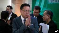 Thai Minister of Digital Economy and Society, Phutthipong Punnakan, center, greets during a news conference to announce the launching of government run anti-fake news center in Bangkok, Thailand Wednesday, Aug. 21. 2019. 