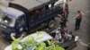 Police leave after arrested several protesters and dismantling their barricades in Yangon, Myanmar, Saturday, March 13, 2021.Security forces in Myanmar on Saturday again met protests against last month's military takeover with lethal force, killing a hand