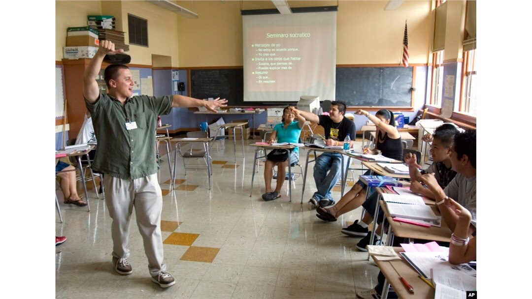 FILE — Teacher Xavier Chavez, standing, teaches a summer history class at Benson High School in Portland, Oregon.
