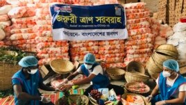 Members of Bidyanondo Foundation pack care packages for COVID-19 patients in Dhaka, Bangladesh, June 6, 2020.