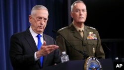 Secretary of Defense Jim Mattis, left, and Chairman of the Joint Chiefs of Staff, Marine Gen. Joseph Dunford speak to reporters during a news conference at the Pentagon, Aug. 28, 2018, in Washington. 