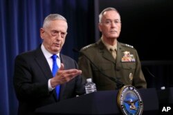 Secretary of Defense Jim Mattis, left, and Chairman of the Joint Chiefs of Staff, Marine Gen. Joseph Dunford, speak to reporters during a news conference at the Pentagon, Aug. 28, 2018.