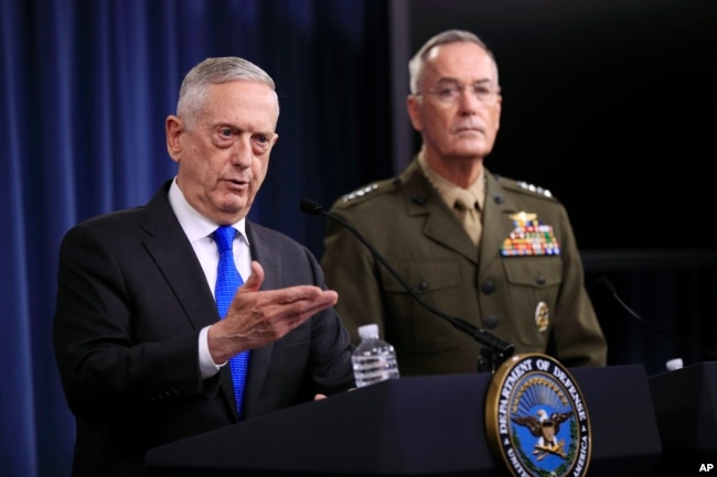 Secretary of Defense Jim Mattis, left, and Chairman of the Joint Chiefs of Staff, Marine Gen. Joseph Dunford, speak to reporters during a news conference at the Pentagon, Aug. 28, 2018.