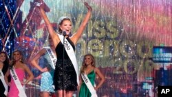 Miss Ohio Matti-Lynn Chrisman introduces herself at the start of the third and final night of preliminary competition at the Miss America competition in Atlantic City, N.J., Sept. 7, 2018. 