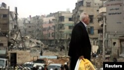 دمشق کے ایک مضافاتی علاقے میں تباہی کا منظر