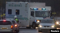 A convoy carrying a female Ebola patient arrives at the Royal Free Hospital in London Dec. 30, 2014.