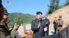 FILE - This image made from video of a news bulletin aired by North Korea's KRT July 4, 2017, shows what was said to be North Korea leader Kim Jung Un, center, applauding after the launch of a Hwasong-14 intercontinental ballistic missile.