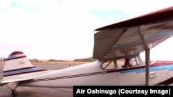 Oshinuga in his vintage Cessna airplane