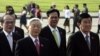 FILE - Vietnam's chairman of the National Assembly Nguyen Sinh Hung, left, Communist Party chief Nguyen Phu Trong, second from left, Prime Minister Nguyen Tan Dung, third from left, and President Truong Tan Sang in Hanoi, May 20, 2013.