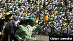 Mugabe and wife, Grace, at the National Sports Stadium, Harare.