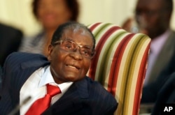 FILE - Zimbabwe's President Robert Mugabe, during his meeting with South African President Jacob Zuma, at the Presidential Guesthouse in Pretoria, South Africa, Oct. 3, 2017.