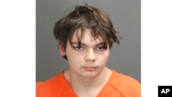 FILE - This booking photo released by the Oakland County, Mich., Sheriff's Office shows Ethan Crumbley, then 15, who was charged as an adult with murder and terrorism for a school shooting in 2021.
