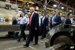 Republican presidential candidate Donald Trump takes a tour of McLanahan Corporation headquarters, a company that manufactures mineral and agricultural equipment, Aug. 12, 2016, in Hollidaysburg, Pa.
