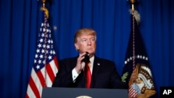 FILE - President Donald Trump speaks after the U.S. fired a barrage of cruise missiles into Syria Thursday night in retaliation for this week's gruesome chemical weapons attack against civilians, at Mar-a-Lago in Palm Beach, Fla., April 6, 2017.