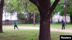 FILE - North Charleston police officer Michael Slager (R) is seen allegedly shooting 50-year-old Walter Scott in the back as he runs away, in this still image from video in North Charleston, South Carolina taken April 4, 2015.