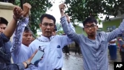 FILE - Image made from video released by the Democratic Voice of Burma July 18, 2017, shows, from left, Burmese journalists Lawi Weng, from the Irrawaddy, Aye Nai, from the Democratic Voice of Burma, and Pyae Bone Naing, from the Democratic Voice of Burma.