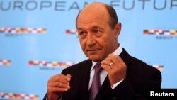 FILE - Romania's President Traian Basescu in Bucharest, June 25, 2014. 