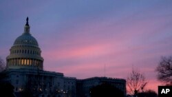 The Capitol Dome of the Capitol Building at sunrise, Feb. 9, 2018, in Washington. Congressional negotiators have reached the critical stage in talks to shape a $1.3 trillion spending bill.