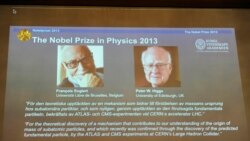 Images of Francois Englert of Belgium and Britain's Peter Higgs, laureates of the 2013 Nobel Prize in Physics, are displayed on a screen during a news conference at the Royal Swedish Academy of Sciences in Stockholm October 8, 2013. Higgs and Englert won