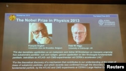 Images of Francois Englert of Belgium and Britain's Peter Higgs, laureates of the 2013 Nobel Prize in Physics, are displayed on a screen during a news conference at the Royal Swedish Academy of Sciences in Stockholm October 8, 2013. Higgs and Englert won