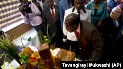 Zimbabwe Mugabe's Birthday - Blows Birthday Candle
