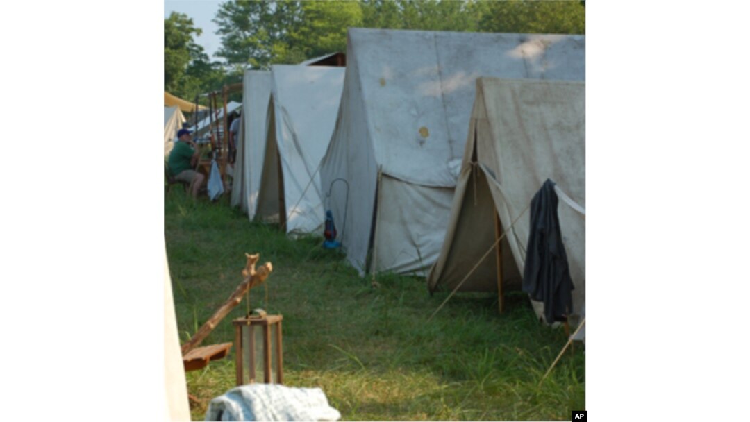 Arriving a day or two before the battle, the re-enactors set up camp in nearby fields, pitching white canvas tents.