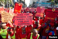 FILE - Members of the National Union of Metal Workers of South Africa (NUMSA) protest on the streets of Durban, July 1, 2014.