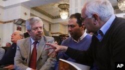 Nofal Al Dawalibi (l), son of former Syrian PM, speaks to journalists before a news conference to unveil a plan to form Syrian interim government in Paris, France, April 26, 2012. 