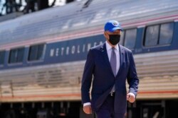 President Joe Biden arrives to speak at an event to mark Amtrak's 50th anniversary at 30th Street Station in Philadelphia, April 30, 2021.