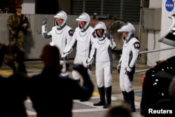 NASA astronaut Jasmin Moghbeli, European Space Agency astronaut Andreas Mogensen, Japan Aerospace Exploration Agency astronaut Satoshi Furukawa and Roscosmos cosmonaut Konstantin Borisov depart their crew quarters for the launch pad before their mission to the International Space Station at Cape Canaveral, Florida, on Aug. 25, 2023.