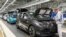 FILE - An employee works at a production line of the electric Volkswagen model ID.3 in Zwickau, Germany, Feb. 25, 2020.