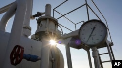 FILE - A gas pressure gauge of a main gas pipeline from Russia in the village of Boyarka near the capital Kyiv, Ukraine on Tuesday, Feb. 12, 2008. 