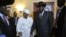 Sudanese President Omar al-Bashir (Center L) smiles after shaking hands with his South Sudanese counterpart Salva Kiir (Center R) following a meeting in the Ethiopian capital Addis Ababa, July 14, 2012. 