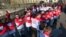Volunteers hold hands on the Pont des Arts pedestrian bridge in central Paris to create a human chain as part of World AIDS Day, December 1, 2012.