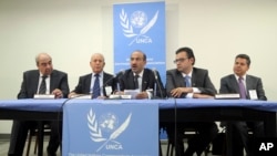 The leader of Syria's Western-backed opposition group Ahmad Al-Jarba (C) speaks to reporters after an informal Security Council meeting on the situation in Syria, July 26, 2013 at United Nations headquarters. 