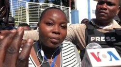 VOA Creole reporter Florence Lisene filed a complaint against National Police officers who attacked journalists covering a peaceful anti-government protest in Port-au-Prince. (Matiado Vilme / VOA)
