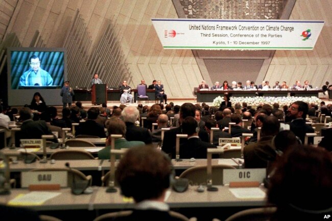 FILE - Kyoto Gov. Teiichi Aramaki makes a speech during the opening session of the U.N. Framework Convention on Climate Change, Dec. 1, 1997 in Kyoto, western Japan. (AP Photo/Katsumi Kasahara File)