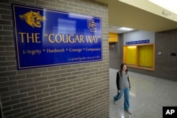 Makenzie Gilkison walks down the hallway at Greenfield Central High School, Tuesday, December 17, 2024, in Greenfield, Indiana.