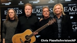 FILE - Members of the Eagles, from left, Timothy B. Schmit, Don Henley, Glenn Frey and Joe Walsh pose after a news conference at the 2013 Sundance Film Festival, in Park City, Utah, Jan. 19, 2013.