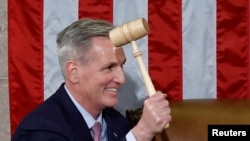 FILE: U.S. House Republican Leader Kevin McCarthy (R-CA) wields the Speaker's gavel after being elected the next Speaker of the U.S. House of Representatives in a late night 15th round of voting at the U.S. Capitol in Washington, U.S., January 7, 2023. 