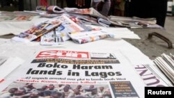 Newspapers are displayed at a vendor's stand along a road in Obalende district in Nigeria's commercial capital Lagos, July 30, 2013.