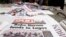 Newspapers are displayed at a vendor's stand along a road in Obalende district in Nigeria's commercial capital Lagos, July 30, 2013.