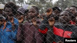 People attend the burial ceremony of Kenya's marathon world record holder Kelvin Kiptum, who died in a road accident, at his home in Naiberi village, Uasin Gishu County, Kenya, February 23, 2024.