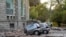 Damaged cars outside the Faculty of Geology building after an earthquake in Tirana, Sept. 21, 2019. Albania's government and news reports say an earthquake with a preliminary magnitude of 5.8 shook in the country's west and injured at least two people.