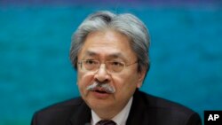 FILE - In this Nov. 4, 2016 file photo, Financial Secretary John Tsang speaks during a press conference at the government headquarters in Hong Kong. 