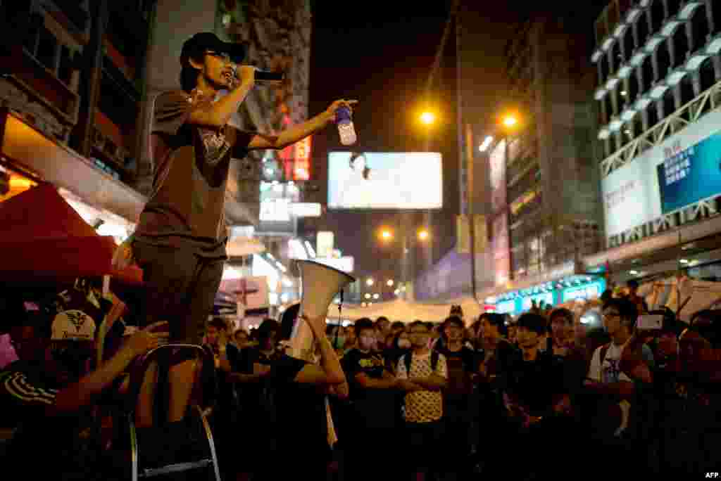 A pro-democracy protester talks on a loudspeaker to there gathered in the Mong Kok district of Hong Kong, Oct. 5, 2014. 