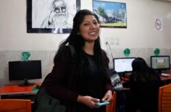 University student Clara Huanca, who is studying education, poses for a portrait at an internet cafe where she worked on a project with classmates in La Paz, Bolivia, Sept. 17, 2019.