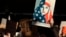 A protester holds a sign at San Francisco International Airport during a demonstration to denounce President Donald Trump's executive order that bars citizens of seven predominantly Muslim-majority countries from entering the U.S., Jan. 28, 2017.